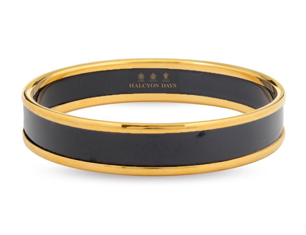 Women's black enamel bangle with gold rims and Halcyon Days logo
